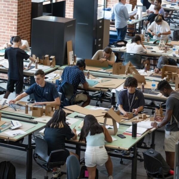 Architecture camps students working at large desks